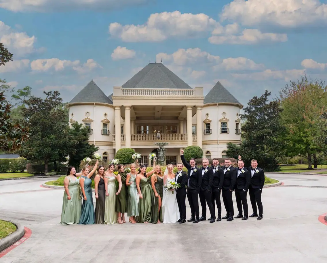 fun photo of a wedding party in front of the Springs Cypress Wedding Venue in Cypress, Texas