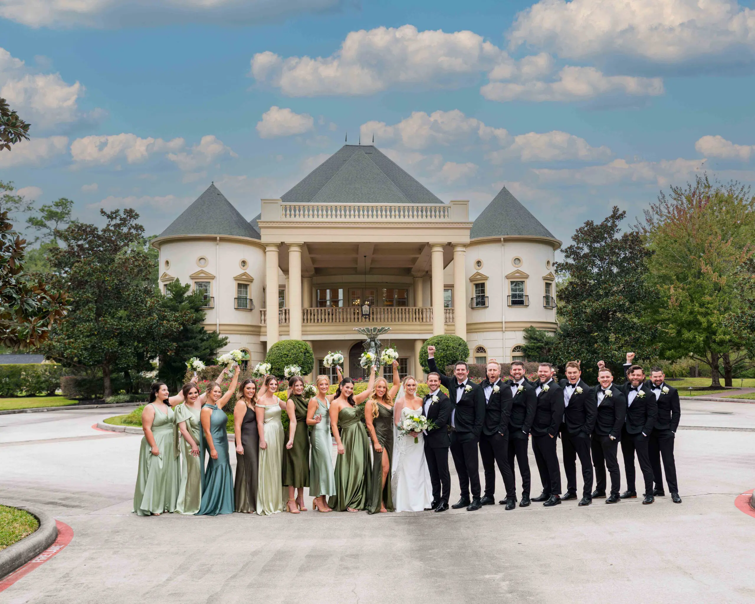 Wedding party standing in front of The Springs Cypress wedding venue exterior