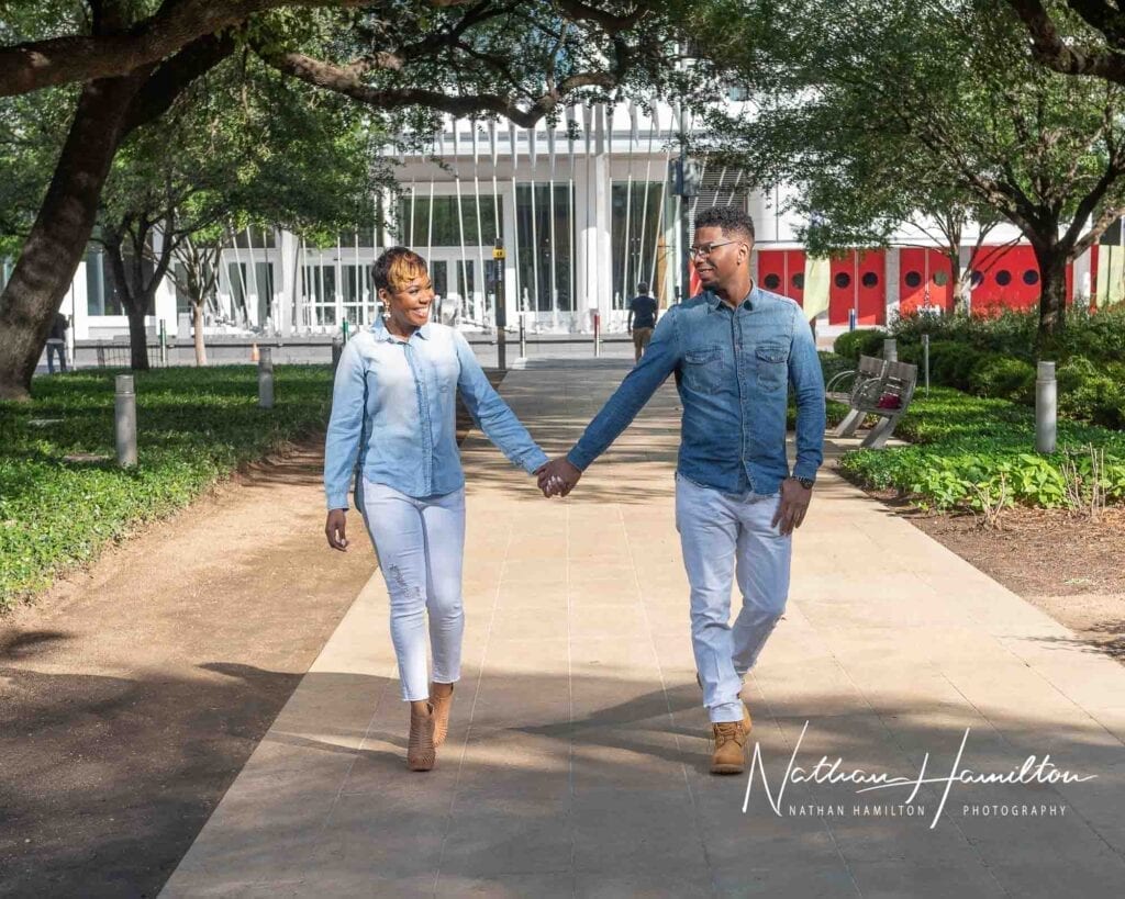 couple holding hands at engagement photoshoot